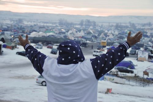 Activist at Standing Rock greets the morning - photograph by C.S. Hagen